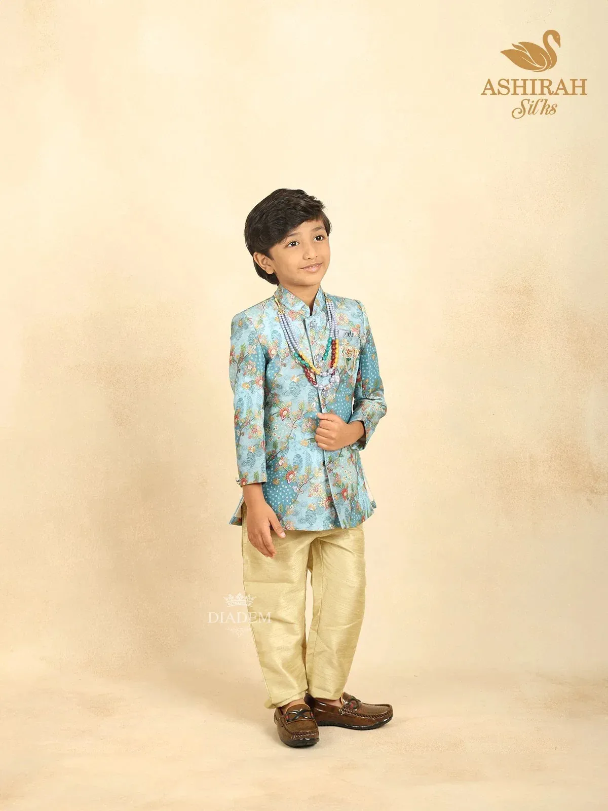 Coral Blue Raw Silk Sherwani with Floral Prints paired with Contrast Pant and Pearl Mala