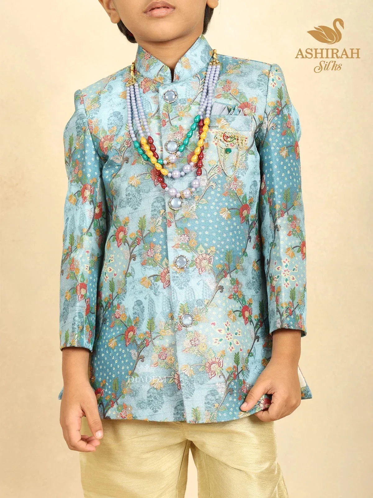Coral Blue Raw Silk Sherwani with Floral Prints paired with Contrast Pant and Pearl Mala