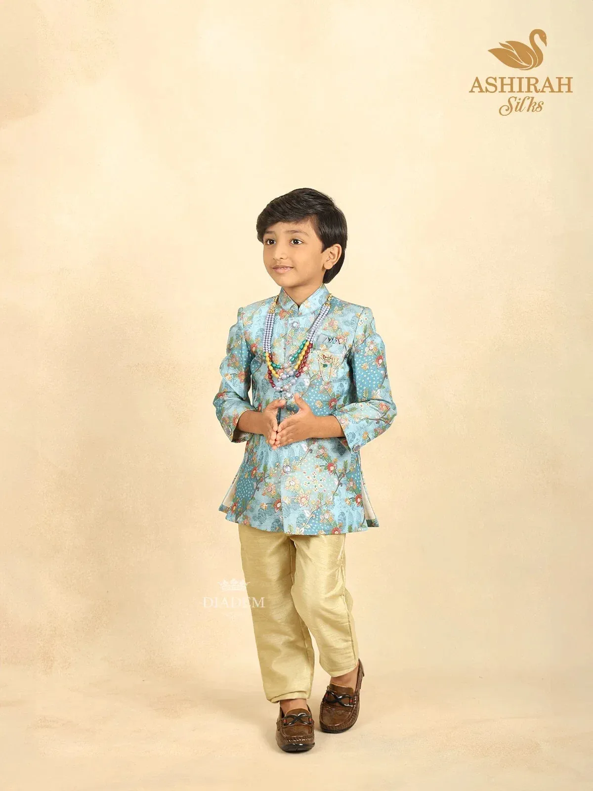 Coral Blue Raw Silk Sherwani with Floral Prints paired with Contrast Pant and Pearl Mala
